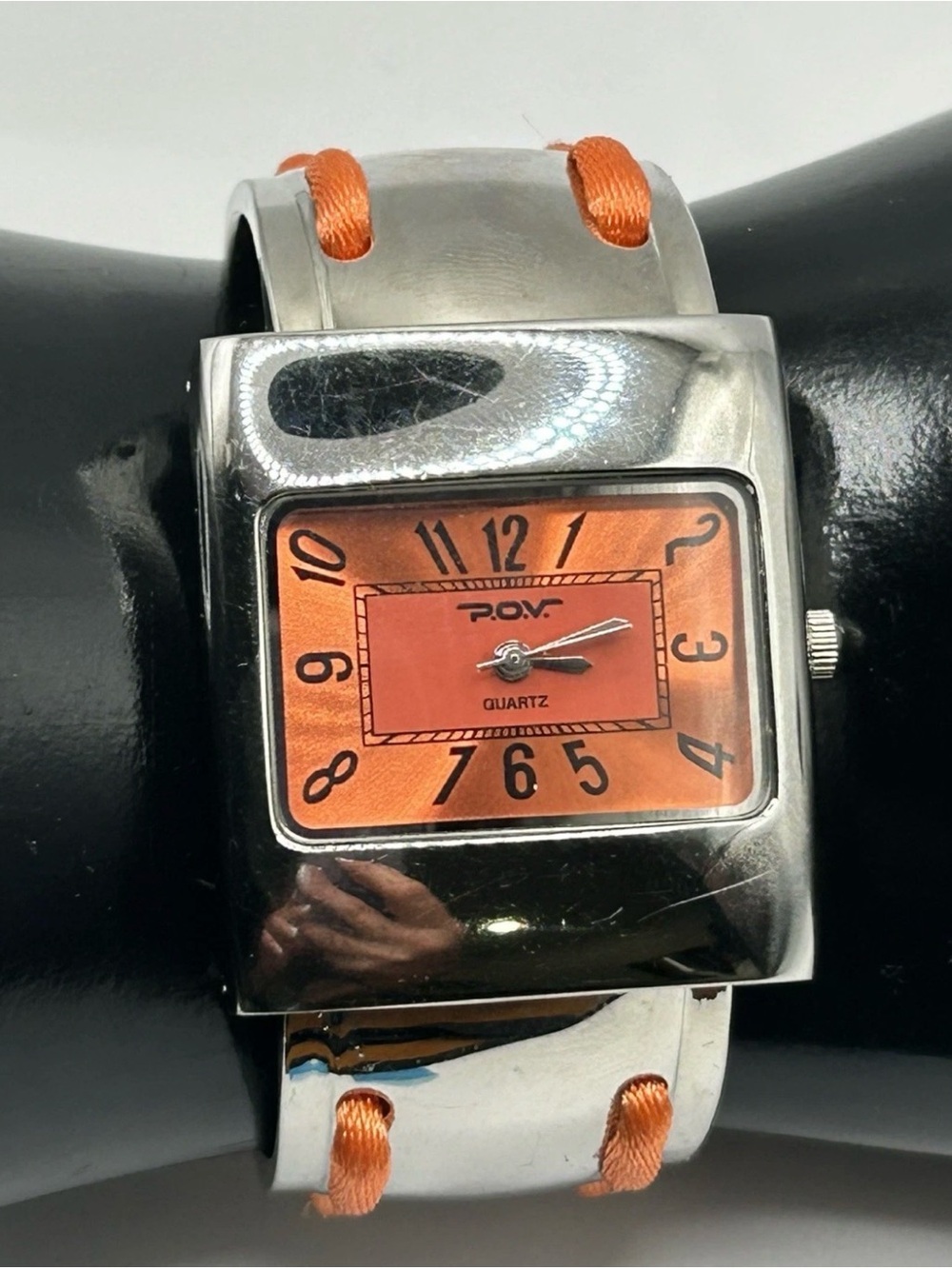 Vintage βP.O.V.β Silver Tone and Orange Cuff Watch